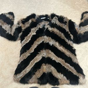 Patterned black and tan Angora fur jacket.